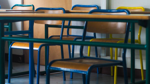 Rows of chairs in a classroom, during the covid-19 pandemic